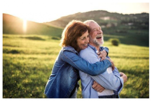 Aging at Home - Happy Canadian couple 55+ celebrating life with a reverse mortgage